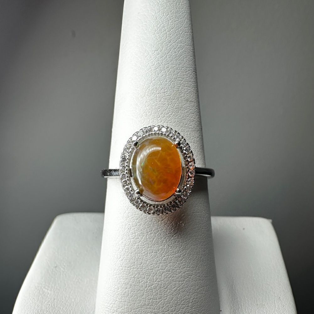Stunning orange 9X7mm oval cabochon opal in sterling silver adjustable ring!‎